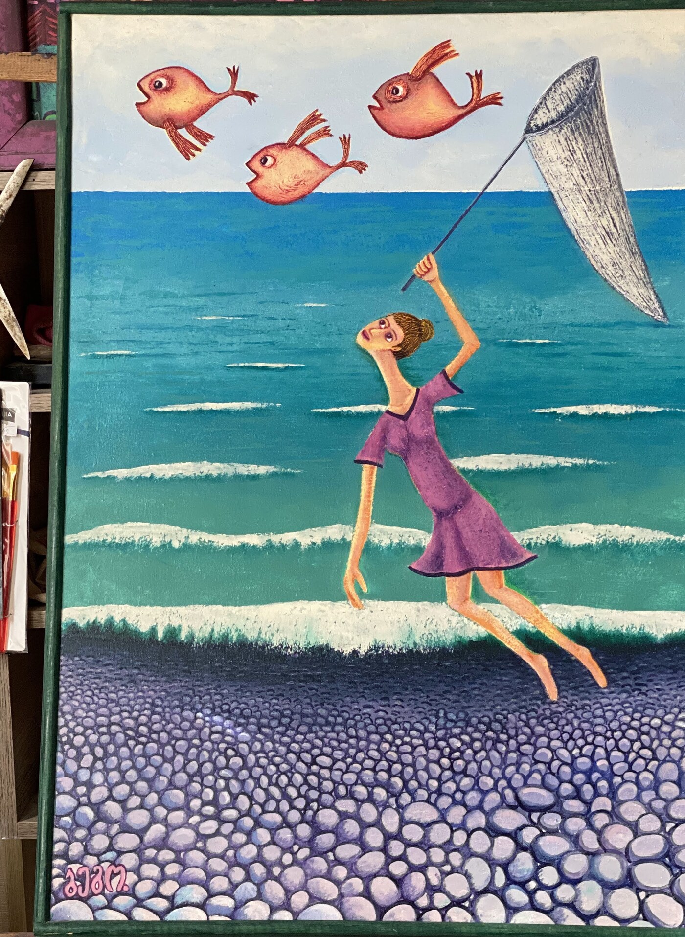 Girl catching flying fish with a net